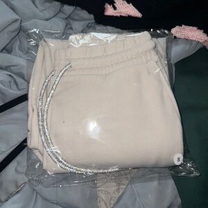 Size small sparkly joggers in cream/beige